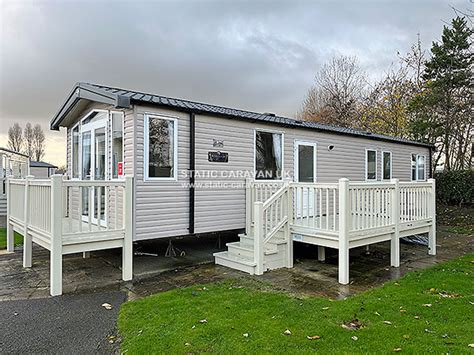 It has a large gated decking area with rattan patio furniture and a private tarmac parking space. . Dog friendly caravans butlins skegness